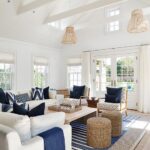 White and blue cottage living room features white…